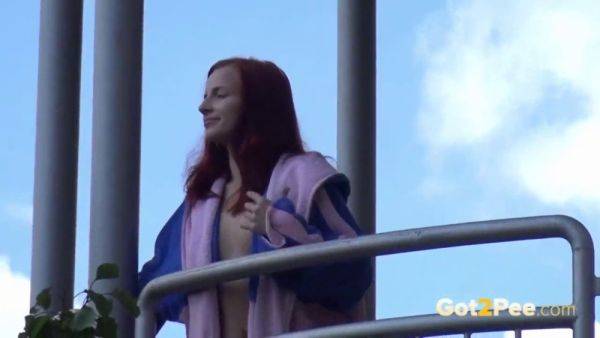 Watch this kinky redhead get a public surprise while peeing in the city - sexu.com on nochargetube.com