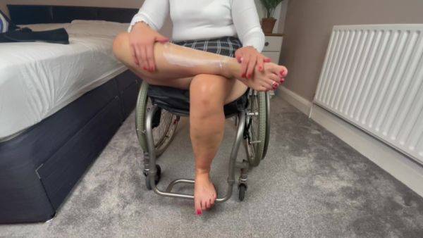 Wheelchair Girl Massaging Legs And Feet After Work - hclips.com on nochargetube.com